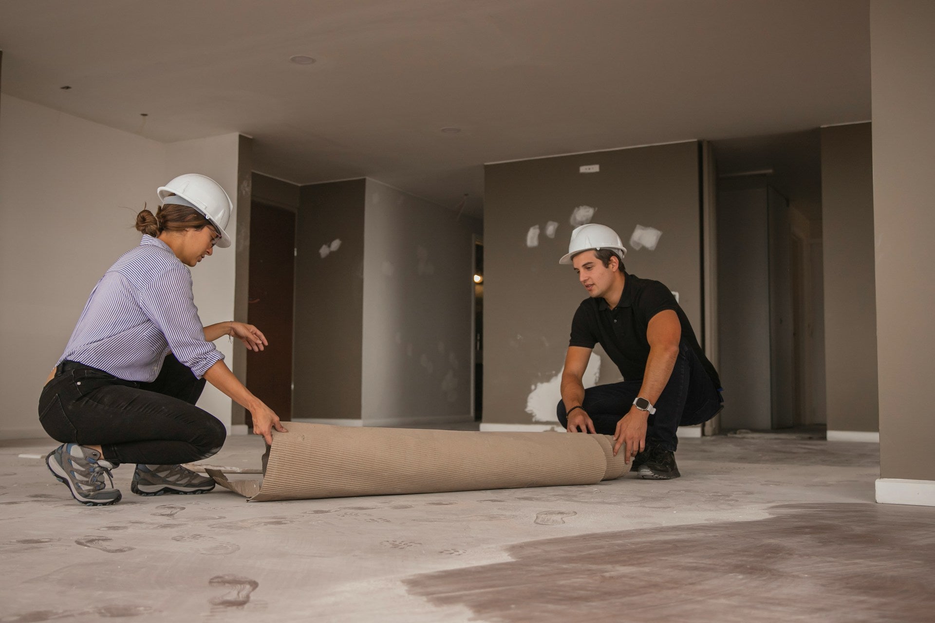 man and woman soundproofing floor